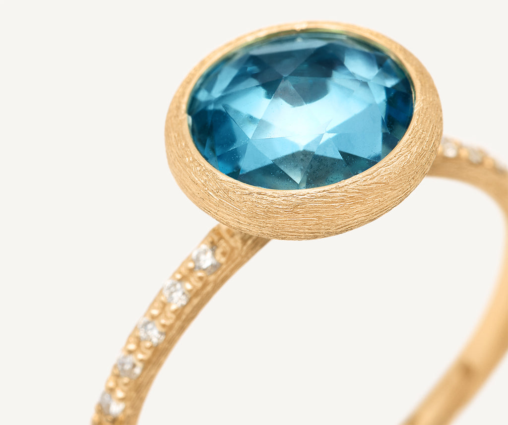 18kt yellow gold ring with sky topaz and diamonds